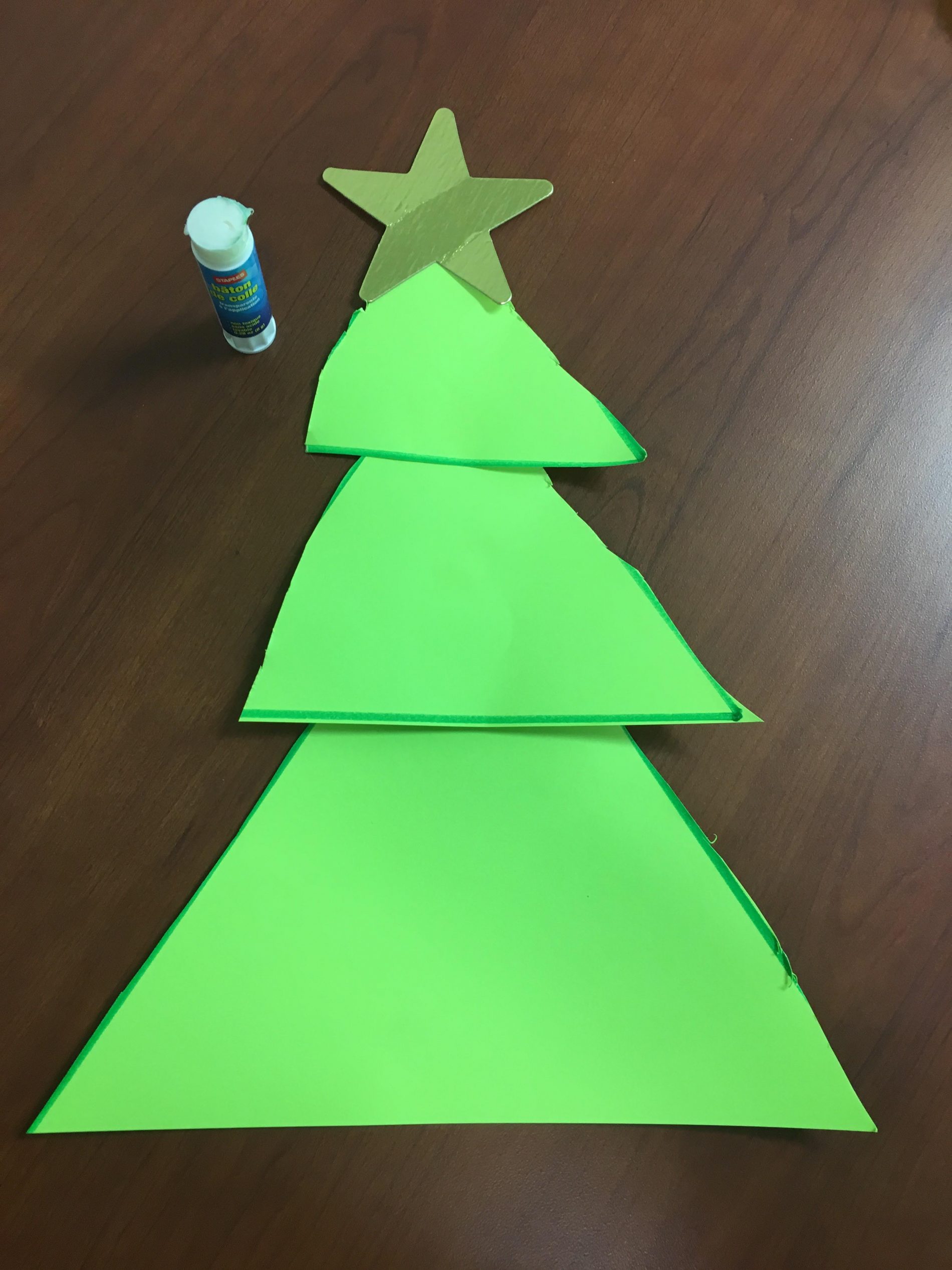 Green paper Christmas tree with a star on top