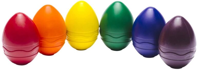 Row of six egg-shaped crayons in red, orange, yellow, green, blue and purple