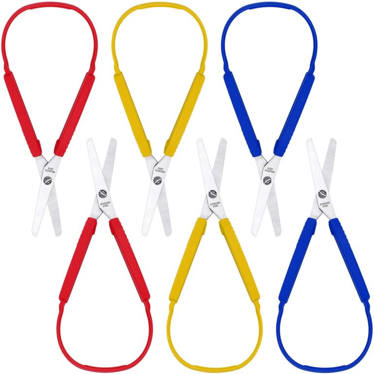 Six pairs of loop-handle adapted scissors in red, yellow and blue