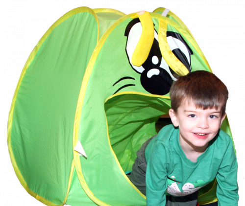 Smiling boy crawling out of a green caterpillar play tent